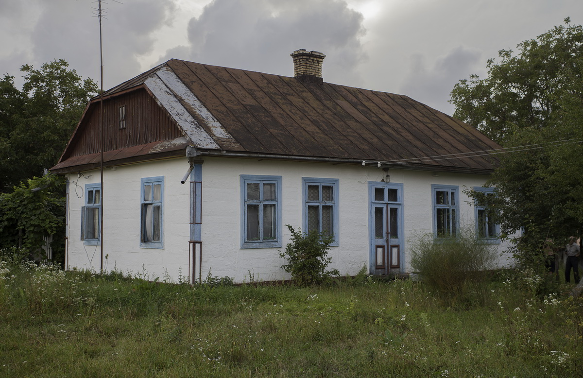 Außenansicht deutscher Wohngebäude in der ehemaligen deutschen Kolonie Winzentiwka  (heute Dorf Sawitne, Rajon Kiwerzi, Wolyn)